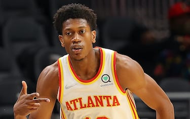 ATLANTA, GEORGIA - OCTOBER 14:  De'Andre Hunter #12 of the Atlanta Hawks reacts after hitting a three-point basket against the Miami Heat during the first half at State Farm Arena on October 14, 2021 in Atlanta, Georgia.  NOTE TO USER: User expressly acknowledges and agrees that, by downloading and or using this photograph, User is consenting to the terms and conditions of the Getty Images License Agreement.  (Photo by Kevin C. Cox/Getty Images)