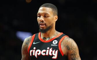 PORTLAND, OREGON - NOVEMBER 20: Damian Lillard #0 of the Portland Trail Blazers reacts during the first quarter of the game against the Philadelphia 76ers at Moda Center on November 20, 2021 in Portland, Oregon. NOTE TO USER: User expressly acknowledges and agrees that, by downloading and or using this photograph, User is consenting to the terms and conditions of the Getty Images License Agreement.  (Photo by Abbie Parr/Getty Images)