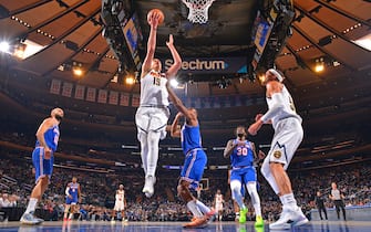 NEW YORK, NY - DECEMBER 4: Nikola Jokic #15 of the Denver Nuggets drives to the basket against the New York Knicks on December 4, 2021 at Madison Square Garden in New York, New York. NOTE TO USER: User expressly acknowledges and agrees that, by downloading and/or using this Photograph, user is consenting to the terms and conditions of the Getty Images License Agreement. Mandatory Copyright Notice: Copyright 2021 NBAE (Photo by Jesse D. Garrabrant/NBAE via Getty Images)