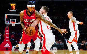 1237041706 HOUSTON, TX - DECEMBER 05: Brandon Ingram #14 of the New Orleans Pelicans dribbles as Garrison Mathews #25 of the Houston Rockets defends during the game at Toyota Center on December 5, 2021 in Houston, Texas. NOTE TO USER: User expressly acknowledges and agrees that, by downloading and/or using this Photograph, user is consenting to the terms and conditions of the Getty Images License Agreement. (Photo by Alex Bierens de Haan/Getty Images)