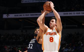 MINNEAPOLIS, MN -  DECEMBER 6: Danilo Gallinari #8 of the Atlanta Hawks shoots a three point basket during the game against the Minnesota Timberwolves on December 6, 2021 at Target Center in Minneapolis, Minnesota. NOTE TO USER: User expressly acknowledges and agrees that, by downloading and or using this Photograph, user is consenting to the terms and conditions of the Getty Images License Agreement. Mandatory Copyright Notice: Copyright 2021 NBAE (Photo by David Sherman/NBAE via Getty Images)