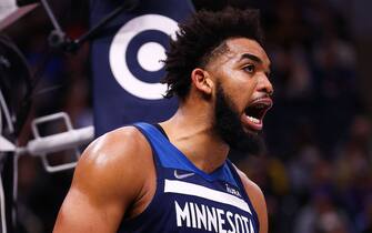 MINNEAPOLIS, MN - DECEMBER 06: Karl-Anthony Towns #32 of the Minnesota Timberwolves reacts after a play during the third quarter against the Atlanta Hawks at Target Center on December 6, 2021 in Minneapolis, Minnesota. NOTE TO USER: User expressly acknowledges and agrees that, by downloading and or using this photograph, User is consenting to the terms and conditions of the Getty Images License Agreement. (Photo by Harrison Barden/Getty Images)