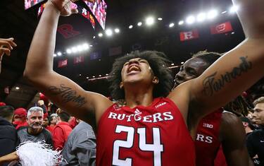 PISCATAWAY, NJ - DECEMBER 09: Ron Harper Jr. #24 of the Rutgers Scarlet Knights celebrates after scoring a three-point basket to defeat the Purdue Boilermakers 70-68  in a game at Jersey Mike's Arena on December 9, 2021 in Piscataway, New Jersey. (Photo by Rich Schultz/Getty Images)