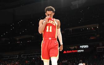 ATLANTA, GA - DECEMBER 13: Trae Young #11 of the Atlanta Hawks looks on before the game against the Houston Rockets on December 13, 2021 at State Farm Arena in Atlanta, Georgia.  NOTE TO USER: User expressly acknowledges and agrees that, by downloading and/or using this Photograph, user is consenting to the terms and conditions of the Getty Images License Agreement. Mandatory Copyright Notice: Copyright 2021 NBAE (Photo by Adam Hagy/NBAE via Getty Images)