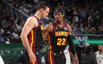 MILWAUKEE, WI - JULY 1: Danilo Gallinari #8 talks with Cam Reddish #22 of the Atlanta Hawks during Game 5 of the Eastern Conference Finals of the 2021 NBA Playoffs on July 1, 2021 at the Fiserv Forum Center in Milwaukee, Wisconsin. NOTE TO USER: User expressly acknowledges and agrees that, by downloading and or using this Photograph, user is consenting to the terms and conditions of the Getty Images License Agreement. Mandatory Copyright Notice: Copyright 2021 NBAE (Photo by Gary Dineen/NBAE via Getty Images).