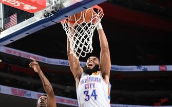 DETROIT, MI - DECEMBER 6: Kenrich Williams #34 of the Oklahoma City Thunder dunks the ball during the game against the Detroit Pistons on December 6, 2021 at Little Caesars Arena in Detroit, Michigan. NOTE TO USER: User expressly acknowledges and agrees that, by downloading and/or using this photograph, User is consenting to the terms and conditions of the Getty Images License Agreement. Mandatory Copyright Notice: Copyright 2021 NBAE (Photo by Chris Schwegler/NBAE via Getty Images)