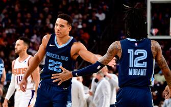 PHOENIX, AZ - DECEMBER 27: Desmond Bane #22 and Ja Morant #12 of the Memphis Grizzlies celebrate during the game against the Phoenix Suns on December 27, 2021 at Footprint Center in Phoenix, Arizona. NOTE TO USER: User expressly acknowledges and agrees that, by downloading and or using this photograph, user is consenting to the terms and conditions of the Getty Images License Agreement. Mandatory Copyright Notice: Copyright 2021 NBAE (Photo by Barry Gossage/NBAE via Getty Images)