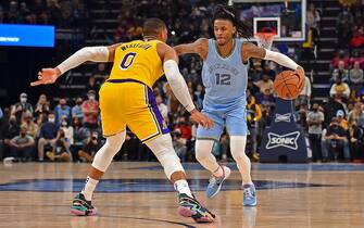 MEMPHIS, TENNESSEE - DECEMBER 29: Memphis Grizzlies guard Ja Morant #12 handles the ball against Los Angeles Lakers guard Russell Westbrook #0 during the second half at FedExForum on December 29, 2021 in Memphis, Tennessee. NOTE TO USER: User expressly acknowledges and agrees that, by downloading and or using this photograph, User is consenting to the terms and conditions of the Getty Images License Agreement.  (Photo by Justin Ford/Getty Images)