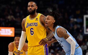 MEMPHIS, TENNESSEE - DECEMBER 29: Los Angeles Lakers forward LeBron James #6 and Memphis Grizzlies guard Ja Morant #12 during the first half at FedExForum on December 29, 2021 in Memphis, Tennessee. NOTE TO USER: User expressly acknowledges and agrees that, by downloading and or using this photograph, User is consenting to the terms and conditions of the Getty Images License Agreement.  (Photo by Justin Ford/Getty Images)