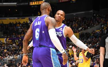 LOS ANGELES, CA - DECEMBER 31: LeBron James #6 of the Los Angeles Lakers greets Russell Westbrook #0 of the Los Angeles Lakers during the game against the Portland Trail Blazers on December 31, 2021 at Crypto.Com Arena in Los Angeles, California. NOTE TO USER: User expressly acknowledges and agrees that, by downloading and/or using this Photograph, user is consenting to the terms and conditions of the Getty Images License Agreement. Mandatory Copyright Notice: Copyright 2021 NBAE (Photo by Andrew D. Bernstein/NBAE via Getty Images)