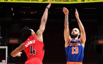 TORONTO, CANADA - JANUARY 2: Evan Fournier #13 of the New York Knicks shoots a three point basket during the game against the Toronto Raptors on January 2, 2022 at the Scotiabank Arena in Toronto, Ontario, Canada.  NOTE TO USER: User expressly acknowledges and agrees that, by downloading and or using this Photograph, user is consenting to the terms and conditions of the Getty Images License Agreement.  Mandatory Copyright Notice: Copyright 2022 NBAE (Photo by Vaughn Ridley/NBAE via Getty Images)