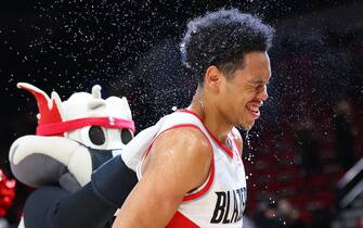 PORTLAND, OREGON - JANUARY 03: Anfernee Simons #1 of the Portland Trail Blazers is doused with water by teammates after a 43 point performance during the 136-131 win against the Atlanta Hawks at Moda Center on January 03, 2022 in Portland, Oregon. NOTE TO USER: User expressly acknowledges and agrees that, by downloading and or using this photograph, User is consenting to the terms and conditions of the Getty Images License Agreement. (Photo by Abbie Parr/Getty Images)