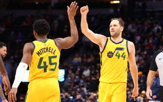 DENVER, CO - JANUARY 05: Bojan Bogdanovic #44 of the Utah Jazz high fives Donovan Mitchell #45 during the third quarter against the Denver Nuggets at Ball Arena on January 5, 2022 in Denver, Colorado. NOTE TO USER: User expressly acknowledges and agrees that, by downloading and or using this photograph, User is consenting to the terms and conditions of the Getty Images License Agreement. (Photo by C. Morgan Engel/Getty Images)