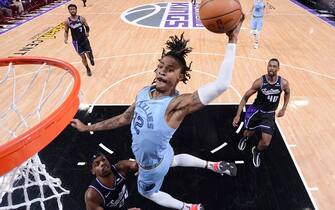 1237509533 SACRAMENTO, CA - DECEMBER 26: Ja Morant #12 of the Memphis Grizzlies dunks against the Sacramento Kings on December 26, 2021 at Golden 1 Center in Sacramento, California. NOTE TO USER: User expressly acknowledges and agrees that, by downloading and or using this photograph, User is consenting to the terms and conditions of the Getty Images Agreement. Mandatory Copyright Notice: Copyright 2021 NBAE (Photo by Rocky Widner/NBAE via Getty Images)