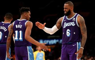 LOS ANGELES, CALIFORNIA - DECEMBER 31: Malik Monk #11 of the Los Angeles Lakers reacts after a play with teammate LeBron James #6 during the fourth quarter against the Portland Trail Blazers at Crypto.com Arena on December 31, 2021 in Los Angeles, California. NOTE TO USER: User expressly acknowledges and agrees that, by downloading and or using this photograph, User is consenting to the terms and conditions of the Getty Images License Agreement. (Photo by Katelyn Mulcahy/Getty Images)