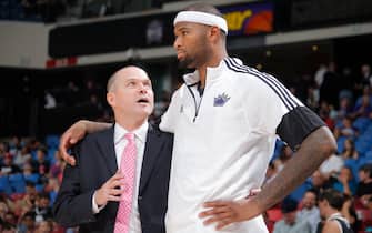SACRAMENTO, CA - October 7: Head Coach of the Sacramento Kings Michael Malone speaks to DeMarcus Cousins #15 during a game against the Toronto Raptors at the Sleep Train Arena in Sacramento, California on October 7, 2014. NOTE TO USER: User expressly acknowledges and agrees that, by downloading and/or using this photograph, user is consenting to the terms and conditions of the Getty Images License Agreement. Mandatory copyright notice: Copyright NBAE 2014 (Photo by Rocky Widner/NBAE via Getty Images)