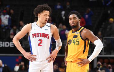 DETROIT, MI - JANUARY 10: Cade Cunningham #2 of the Detroit Pistons and Donovan Mitchell #45 of the Utah Jazz look on during the game on January 10, 2022 at Little Caesars Arena in Detroit, Michigan. NOTE TO USER: User expressly acknowledges and agrees that, by downloading and/or using this photograph, User is consenting to the terms and conditions of the Getty Images License Agreement. Mandatory Copyright Notice: Copyright 2022 NBAE (Photo by Chris Schwegler/NBAE via Getty Images)