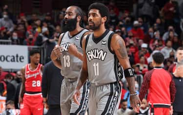 CHICAGO, IL - JANUARY 12: James Harden #13 of the Brooklyn Nets and Kyrie Irving #11 of the Brooklyn Nets look on before the game against the Chicago Bulls on January 12, 2022 at United Center in Chicago, Illinois. NOTE TO USER: User expressly acknowledges and agrees that, by downloading and or using this photograph, User is consenting to the terms and conditions of the Getty Images License Agreement. Mandatory Copyright Notice: Copyright 2022 NBAE (Photo by Jeff Haynes/NBAE via Getty Images)