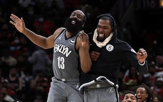 CHICAGO, ILLINOIS - JANUARY 12: James Harden #13 and Kevin Durant #7 of the Brooklyn Nets celebrate after a score during the second half of a game against the Chicago Bulls at United Center on January 12, 2022 in Chicago, Illinois. NOTE TO USER: User expressly acknowledges and agrees that, by downloading and or using this photograph, User is consenting to the terms and conditions of the Getty Images License Agreement. (Photo by Stacy Revere/Getty Images)