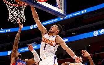 DETROIT, MI - JANUARY 16: Devin Booker #1 of the Phoenix Suns dunks the ball during the game against the Detroit Pistons on January 16, 2022 at Little Caesars Arena in Detroit, Michigan. NOTE TO USER: User expressly acknowledges and agrees that, by downloading and/or using this photograph, User is consenting to the terms and conditions of the Getty Images License Agreement. Mandatory Copyright Notice: Copyright 2022 NBAE (Photo by Brian Sevald/NBAE via Getty Images)