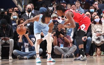 MEMPHIS, TN - JANUARY 17: Ja Morant #12 of the Memphis Grizzlies is defended by Ayo Dosunmu #12 of the Chicago Bulls  against the Chicago Bulls on January 17, 2022 at FedExForum in Memphis, Tennessee. NOTE TO USER: User expressly acknowledges and agrees that, by downloading and or using this photograph, User is consenting to the terms and conditions of the Getty Images License Agreement. Mandatory Copyright Notice: Copyright 2022 NBAE (Photo by Joe Murphy/NBAE via Getty Images)