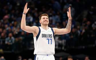 DALLAS, TEXAS - JANUARY 19: Luka Doncic #77 of the Dallas Mavericks reacts after making a basket in the third quarter against the Toronto Raptors at American Airlines Center on January 19, 2022 in Dallas, Texas. NOTE TO USER: User expressly acknowledges and agrees that, by downloading and or using this photograph, User is consenting to the terms and conditions of the Getty Images License Agreement.   (Photo by Tim Heitman/Getty Images)