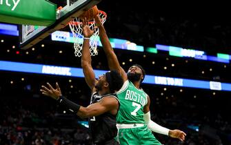BOSTON, MA - JANUARY 25:  Jaylen Brown #7 of the Boston Celtics fouls Terence Davis #3 of the Sacramento Kings during a game at TD Garden on January 25, 2022 in Boston, Massachusetts. NOTE TO USER: User expressly acknowledges and agrees that, by downloading and or using this photograph, User is consenting to the terms and conditions of the Getty Images License Agreement. (Photo by Adam Glanzman/Getty Images)