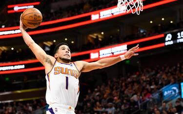 SALT LAKE CITY, UTAH - JANUARY 26: Devin Booker #1 of the Phoenix Suns dunks during the first half of a game against the Utah Jazz at Vivint Smart Home Arena on January 26, 2022 in Salt Lake City, Utah. NOTE TO USER: User expressly acknowledges and agrees that, by downloading and or using this photograph, User is consenting to the terms and conditions of the Getty Images License Agreement. (Photo by Alex Goodlett/Getty Images)