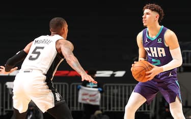 CHARLOTTE, NC - FEBRUARY 14: LaMelo Ball #2 of the Charlotte Hornets handles the ball against the San Antonio Spurs on February 14, 2021 at Spectrum Center in Charlotte, North Carolina. NOTE TO USER: User expressly acknowledges and agrees that, by downloading and or using this photograph, User is consenting to the terms and conditions of the Getty Images License Agreement. Mandatory Copyright Notice: Copyright 2021 NBAE (Photo by Kent Smith/NBAE via Getty Images) 