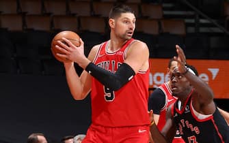 TORONTO, CANADA - FEBRUARY 3: Nikola Vucevic #9 of the Chicago Bulls handles the ball during the game against the Toronto Raptors on February 3, 2022 at the Scotiabank Arena in Toronto, Ontario, Canada.  NOTE TO USER: User expressly acknowledges and agrees that, by downloading and or using this Photograph, user is consenting to the terms and conditions of the Getty Images License Agreement.  Mandatory Copyright Notice: Copyright 2022 NBAE (Photo by Vaughn Ridley/NBAE via Getty Images)