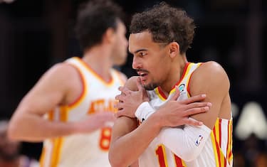 ATLANTA, GEORGIA - FEBRUARY 03:  Trae Young #11 of the Atlanta Hawks reacts after hitting a three-point basket against the Phoenix Suns during the second half at State Farm Arena on February 03, 2022 in Atlanta, Georgia.  NOTE TO USER: User expressly acknowledges and agrees that, by downloading and or using this photograph, User is consenting to the terms and conditions of the Getty Images License Agreement.  (Photo by Kevin C. Cox/Getty Images)