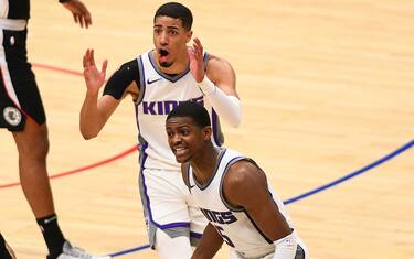 LOS ANGELES, CA - FEBRUARY 07: Sacramento Kings Guard Tyrese Haliburton (0) and Sacramento Kings Guard De'Aaron Fox (5) react to a call by referee Kane Fitzgerald (5) during a NBA game between the Sacramento Kings and the Los Angeles Clippers on February 7, 2021 at STAPLES Center in Los Angeles, CA. The game was played without fans due to the COVID-19 pandemic. (Photo by Brian Rothmuller/Icon Sportswire via Getty Images)