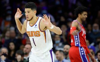 PHILADELPHIA, PENNSYLVANIA - FEBRUARY 08: Devin Booker #1 of the Phoenix Suns reacts during the third quarter against the Philadelphia 76ers at Wells Fargo Center on February 08, 2022 in Philadelphia, Pennsylvania. NOTE TO USER: User expressly acknowledges and agrees that, by downloading and or using this photograph, User is consenting to the terms and conditions of the Getty Images License Agreement. (Photo by Tim Nwachukwu/Getty Images)