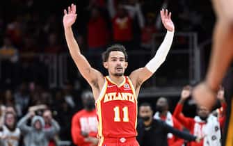 ATLANTA, GA - FEBRUARY 15: Trae Young #11 of the Atlanta Hawks reacts to a play during the game against the Cleveland Cavaliers on February 15, 2022 at State Farm Arena in Atlanta, Georgia.  NOTE TO USER: User expressly acknowledges and agrees that, by downloading and/or using this Photograph, user is consenting to the terms and conditions of the Getty Images License Agreement. Mandatory Copyright Notice: Copyright 2022 NBAE (Photo by Adam Hagy/NBAE via Getty Images)