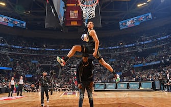 CLEVELAND, OH - FEBRUARY 19: Juan Toscano-Anderson #95 of the Golden State Warriors dunks the ball over Andrew Wiggins #22 during the AT&T Slam Dunk Contest as part of 2022 NBA All Star Weekend on February 19, 2022 at Rocket Mortgage FieldHouse in Cleveland, Ohio. NOTE TO USER: User expressly acknowledges and agrees that, by downloading and/or using this Photograph, user is consenting to the terms and conditions of the Getty Images License Agreement. Mandatory Copyright Notice: Copyright 2022 NBAE (Photo by Jesse D. Garrabrant/NBAE via Getty Images)