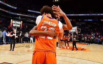PHOENIX, AZ - MARCH 4: Mikal Bridges #25 and Cameron Johnson #23 of the Phoenix Suns hug after the game against the New York Knicks on March 4, 2022 at Footprint Center in Phoenix, Arizona. NOTE TO USER: User expressly acknowledges and agrees that, by downloading and or using this photograph, user is consenting to the terms and conditions of the Getty Images License Agreement. Mandatory Copyright Notice: Copyright 2022 NBAE (Photo by Barry Gossage/NBAE via Getty Images)