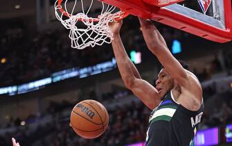 CHICAGO, ILLINOIS - MARCH 04: Giannis Antetokounmpo #34 of the Milwaukee Bucks dunks over Zach LaVine #8 of the Chicago Bulls at the United Center on March 04, 2022 in Chicago, Illinois. The Bucks defeated the Bulls 118-112. NOTE TO USER: User expressly acknowledges and agrees that, by downloading and or using this photograph, User is consenting to the terms and conditions of the Getty Images License Agreement. (Photo by Jonathan Daniel/Getty Images)