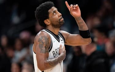 CHARLOTTE, NORTH CAROLINA - MARCH 08: Kyrie Irving #11 of the Brooklyn Nets looks up and points to the sky in the fourth quarter during their game against the Charlotte Hornets at Spectrum Center on March 08, 2022 in Charlotte, North Carolina. NOTE TO USER: User expressly acknowledges and agrees that, by downloading and or using this photograph, User is consenting to the terms and conditions of the Getty Images License Agreement. (Photo by Jacob Kupferman/Getty Images)