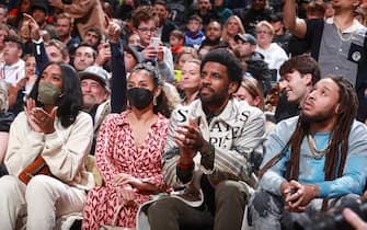 BROOKLYN, NY - MARCH 13: Kyrie Irving #11 of the Brooklyn Nets attends a game against the New York Knicks on March 13, 2022 at Barclays Center in Brooklyn, New York. NOTE TO USER: User expressly acknowledges and agrees that, by downloading and or using this Photograph, user is consenting to the terms and conditions of the Getty Images License Agreement. Mandatory Copyright Notice: Copyright 2022 NBAE (Photo by Nathaniel S. Butler/NBAE via Getty Images)