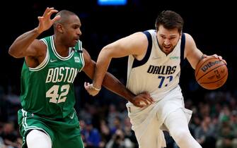 BOSTON, MASSACHUSETTS - MARCH 13: Luka Doncic #77 of the Dallas Mavericks drives towards the basket against Al Horford #42 of the Boston Celtics  at TD Garden on March 13, 2022 in Boston, Massachusetts. NOTE TO USER: User expressly acknowledges and agrees that, by downloading and or using this photograph, User is consenting to the terms and conditions of the Getty Images License Agreement.  (Photo by Maddie Meyer/Getty Images)