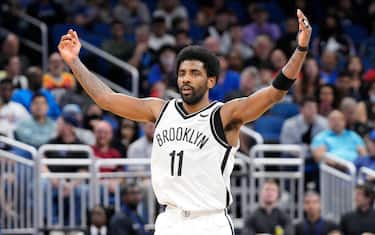 ORLANDO, FLORIDA - MARCH 15: Kyrie Irving #11 of the Brooklyn Nets celebrates after scoring against the Orlando Magic in the first half at Amway Center on March 15, 2022 in Orlando, Florida. NOTE TO USER: User expressly acknowledges and agrees that, by downloading and or using this photograph, User is consenting to the terms and conditions of the Getty Images License Agreement. (Photo by Mark Brown/Getty Images)