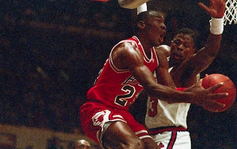 (Original Caption) A pair of aces do battle at Madison Square Garden 4/19 as Chicago Bulls' Michael Jordan leaps for the basket with the New York Knicks' Patrick Ewing defending.