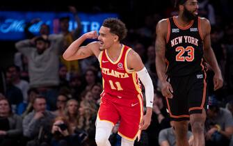 NEW YORK, NEW YORK - MARCH 22: Trae Young #11 of the Atlanta Hawks reacts after a shot against Evan Fournier #13 of the New York Knicks at Madison Square Garden on March 22, 2022 in New York City. NOTE TO USER: User expressly acknowledges and agrees that, by downloading and or using this photograph, User is consenting to the terms and conditions of the Getty Images License Agreement. (Photo by Michelle Farsi/Getty Images)