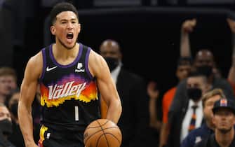 PHOENIX, ARIZONA - MARCH 27: Devin Booker #1 of the Phoenix Suns reacts after scoring against the Philadelphia 76ers during the first half of the NBA game at Footprint Center on March 27, 2022 in Phoenix, Arizona.  The Suns defeated the 76ers 114-104.  
 NOTE TO USER: User expressly acknowledges and agrees that, by downloading and or using this photograph, User is consenting to the terms and conditions of the Getty Images License Agreement. (Photo by Christian Petersen/Getty Images)