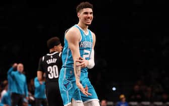 NEW YORK, NEW YORK - MARCH 27: LaMelo Ball #2 of the Charlotte Hornets celebrates after hitting a three pointer against the Brooklyn Nets at Barclays Center on March 27, 2022 in New York City. NOTE TO USER: User expressly acknowledges and agrees that, by downloading and or using this photograph, User is consenting to the terms and conditions of the Getty Images License Agreement. (Photo by Mike Stobe/Getty Images)