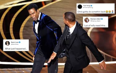 HOLLYWOOD, CA - March 27, 2022.    Will Smith slaps Chris Rock onstage during the show  at the 94th Academy Awards at the Dolby Theatre at Ovation Hollywood on Sunday, March 27, 2022.  (Myung Chun / Los Angeles Times)
