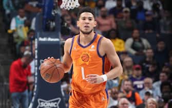 MEMPHIS, TN - APRIL 1: Devin Booker #1 of the Phoenix Suns dribbles the ball during the game against the Memphis Grizzlies on April 1, 2022 at FedExForum in Memphis, Tennessee. NOTE TO USER: User expressly acknowledges and agrees that, by downloading and or using this photograph, User is consenting to the terms and conditions of the Getty Images License Agreement. Mandatory Copyright Notice: Copyright 2022 NBAE (Photo by Joe Murphy/NBAE via Getty Images)
