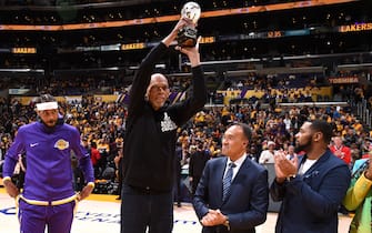 LOS ANGELES, CA - APRIL 3: NBA Legend, Kareem Abdul-Jabbar holds up the KAJ Social Justice Champion Award Trophy as he presents it to Carmelo Anthony #7 of the Los Angeles Lakers prior to the game against the Denver Nuggets on April 3, 2022 at Crypto.Com Arena in Los Angeles, California. NOTE TO USER: User expressly acknowledges and agrees that, by downloading and/or using this Photograph, user is consenting to the terms and conditions of the Getty Images License Agreement. Mandatory Copyright Notice: Copyright 2022 NBAE (Photo by Andrew D. Bernstein/NBAE via Getty Images) 
