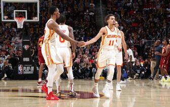 CHICAGO, IL - APRIL 15: Onyeka Okongwu #17 high fives Trae Young #11 of the Atlanta Hawks during the game against the Cleveland Cavaliers during the 2022 Play-In Tournament on April 15, 2022 at Rocket Mortgage Fieldhouse in Cleveland, Ohio. NOTE TO USER: User expressly acknowledges and agrees that, by downloading and or using this photograph, User is consenting to the terms and conditions of the Getty Images License Agreement. Mandatory Copyright Notice: Copyright 2022 NBAE (Photo by Jeff Haynes/NBAE via Getty Images)