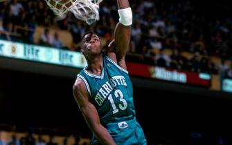 BOSTON, MA - 1993: Kendall Gill #13 of the Charlotte Hornets dunks against the Boston Celtics during a game played at the Boston Garden in Boston, Massachusetts circa 1993. NOTE TO USER: User expressly acknowledges and agrees that, by downloading and or using this photograph, User is consenting to the terms and conditions of the Getty Images License Agreement. Mandatory Copyright Notice: Copyright 1993 NBAE (Photo by Dick Raphael/NBAE via Getty Images)